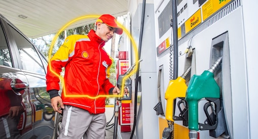 Red car in Shell forecourt