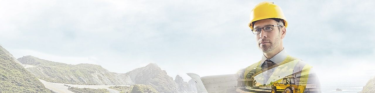  A worker in a yellow hard hat transposed onto a background og a road in some mountains