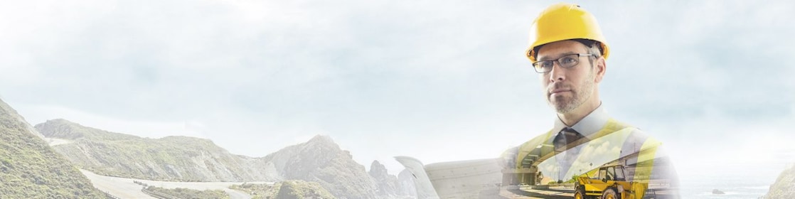  A worker in a yellow hard hat transposed onto a background og a road in some mountains