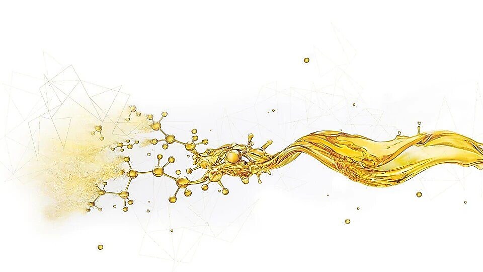 Salpicaduras de aceite rompiéndose en pequeños componentes