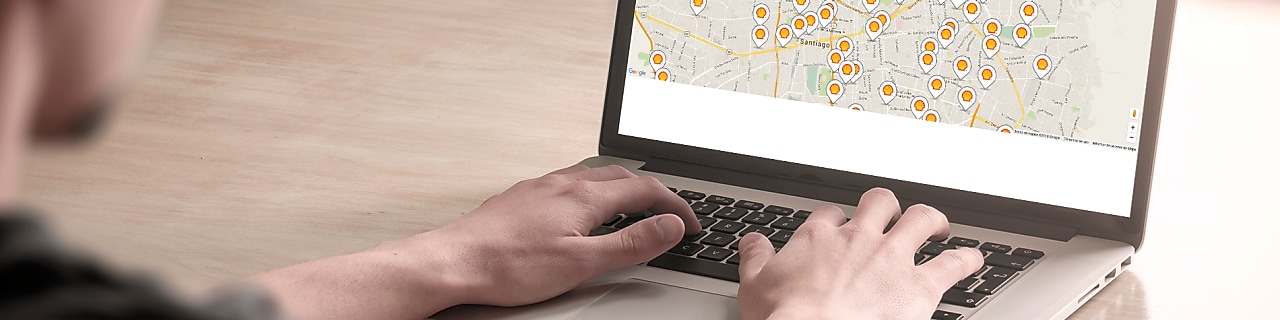 Man looking at a map on a computer