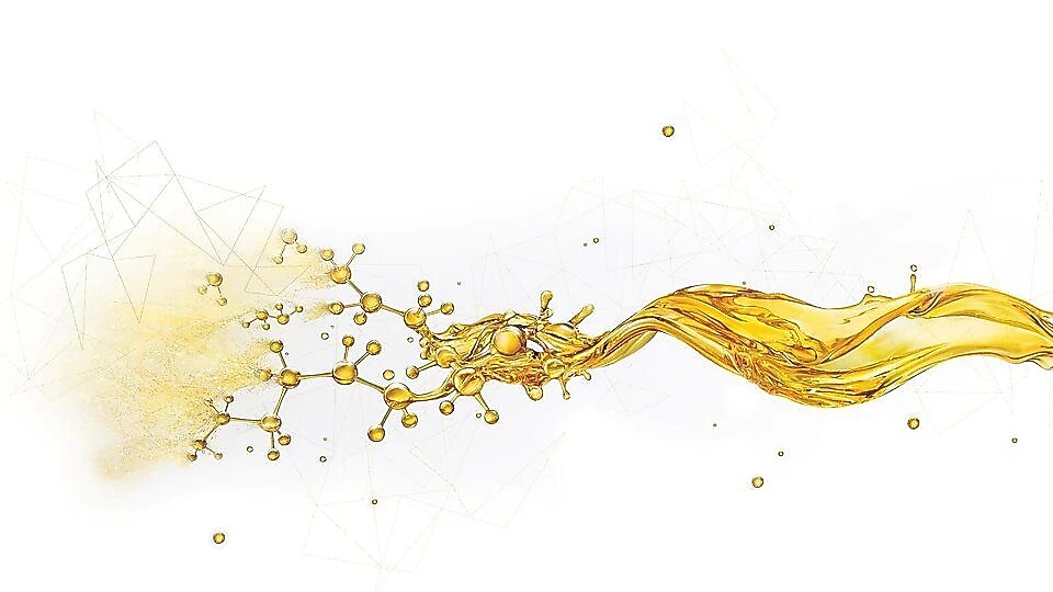 Salpicaduras de aceite rompiéndose en pequeños componentes